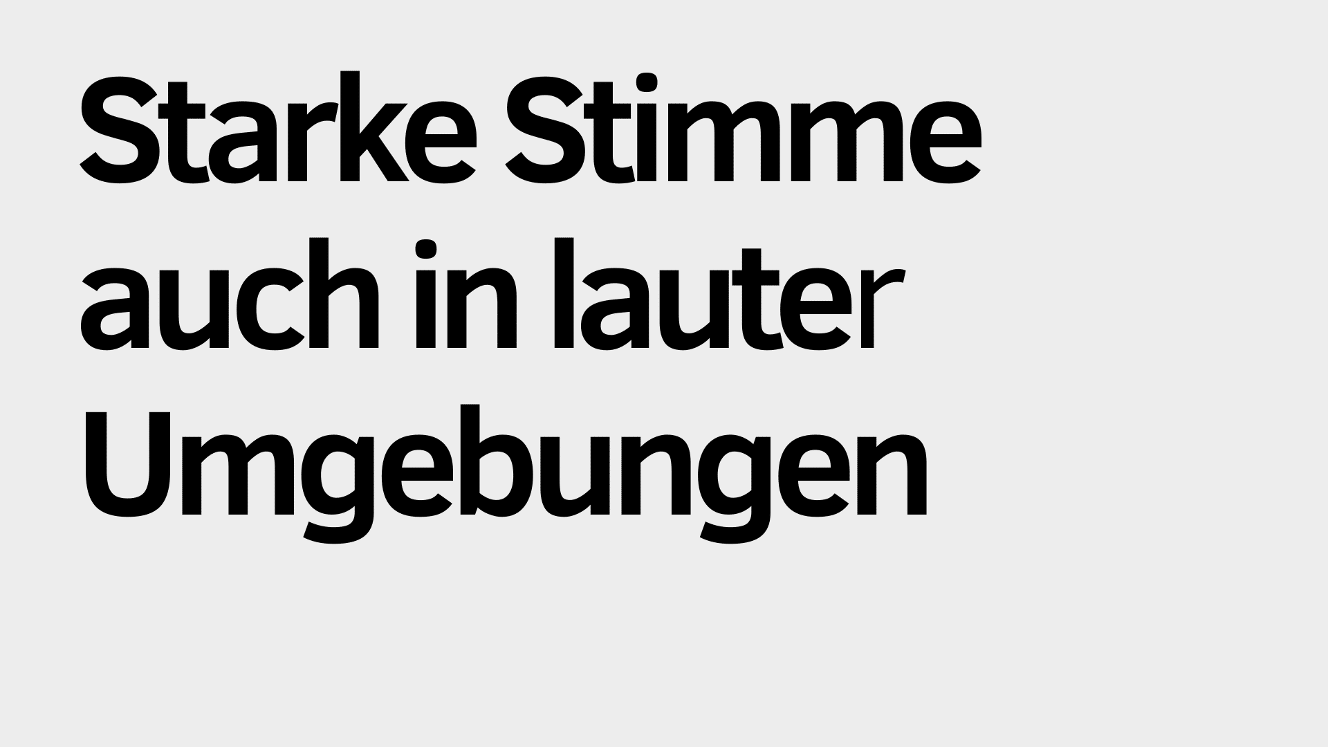 Schwarzer deutscher Text auf hellgrauem Hintergrund lautet: "Starke Stimme auch in lauten Umgebungen", was die Fähigkeit unterstreicht, auch in lauten Umgebungen klar zu kommunizieren.